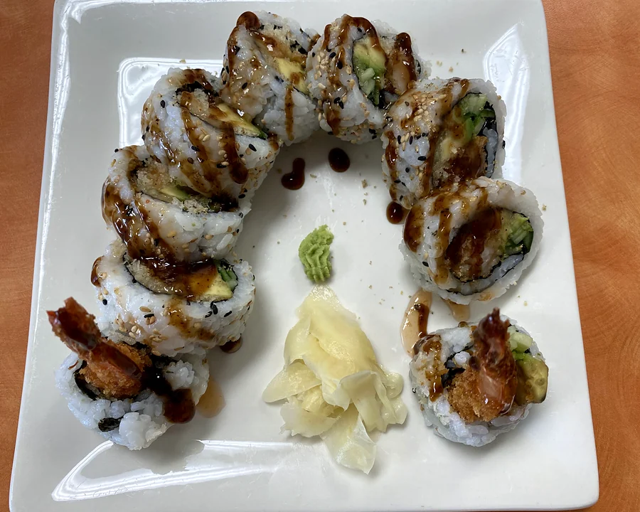 Dynamite roll with tempura shrimp, avocado and cucumber, topped with sweet sauce, with ginger and wasabi at Hana Sushi, Winnipeg